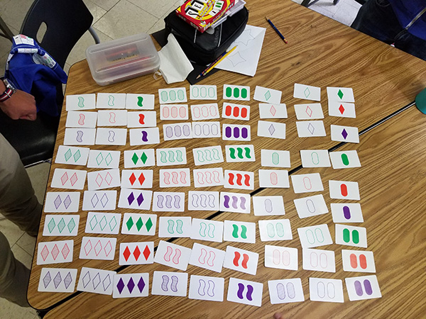 Math card problem laid out on a table
