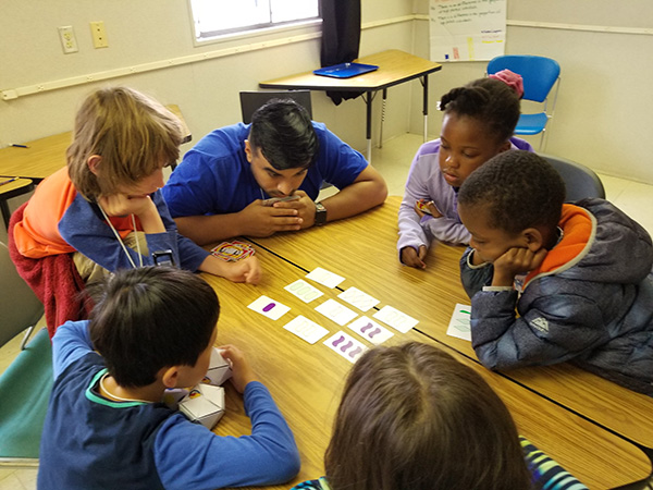 Students working together to solve math problem